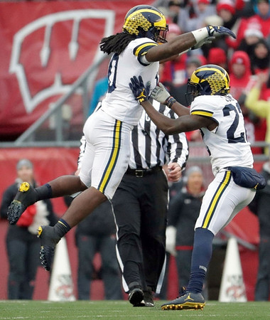 Devin Bush (10) and David Long (22)