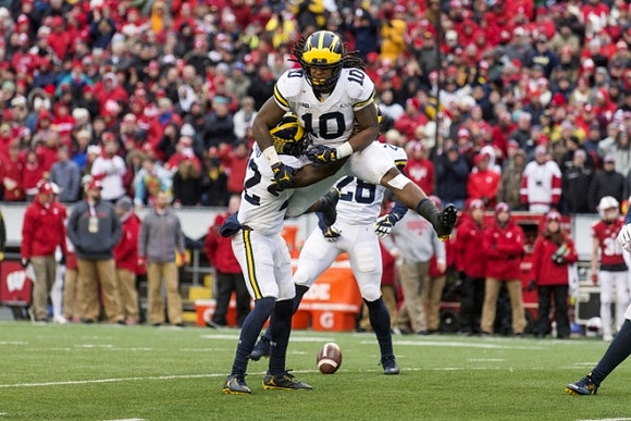 David Long (22), Kwity Paye (19), and Brandon Watson (28)