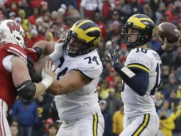 Ben Bredeson (74) and Brandon Peters (18)