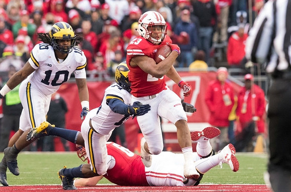 Devin Bush (10) and Josh Metellus (14)