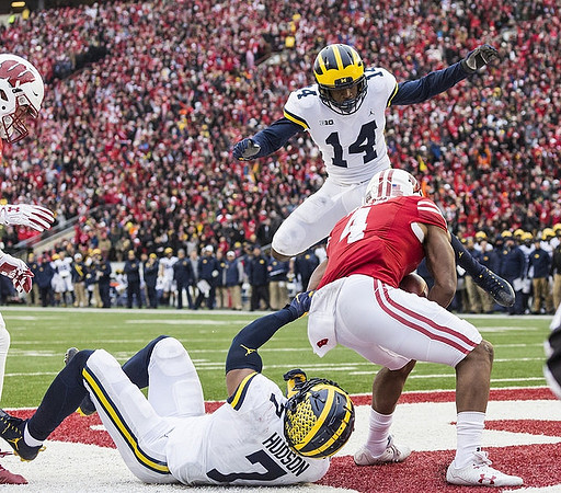 Josh Metellus (14) and Khaleke Hudson (7)