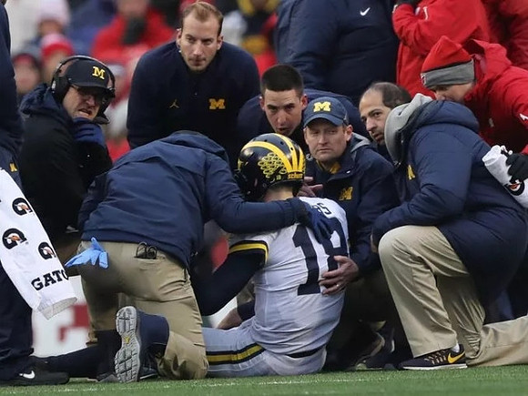 Jim Harbaugh and Brandon Peters (18)