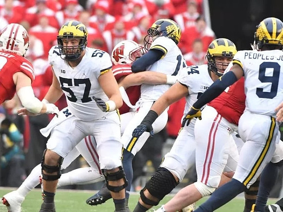 Patrick Kugler (57), Brandon Peters (18), Ben Bredeson (74), and Donovan Peoples-Jones (9)
