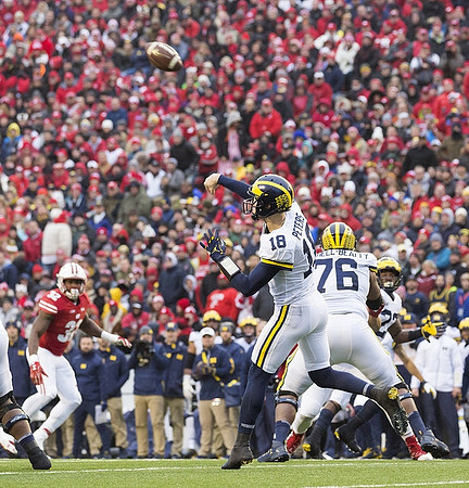Brandon Peters (18) and Juwann Bushell-Beatty (76)