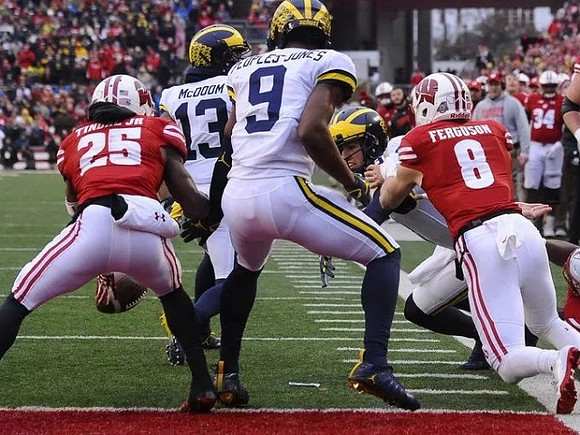 Donovan Peoples-Jones (9), Eddie McDoom (13), and Brandon Peters (18)