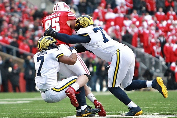 Khaleke Hudson (7) and Maurice Hurst (73)