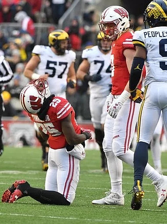 Patrick Kugler (57), Ben Bredeson (74), and Donovan Peoples-Jones (9)