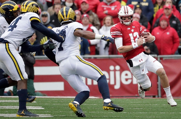 Josh Metellus (14) and Khaleke Hudson (7)