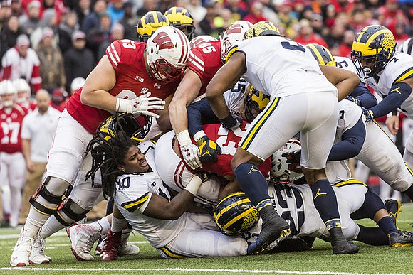 Devin Bush (10), Chase Winovich (15), Tyree Kinnel (23), Mike McCray (9), Rashan Gary (3), and Khaleke Hudson (7)