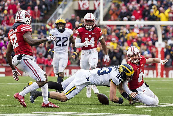 Karan Higdon (22) and Zach Gentry (83)