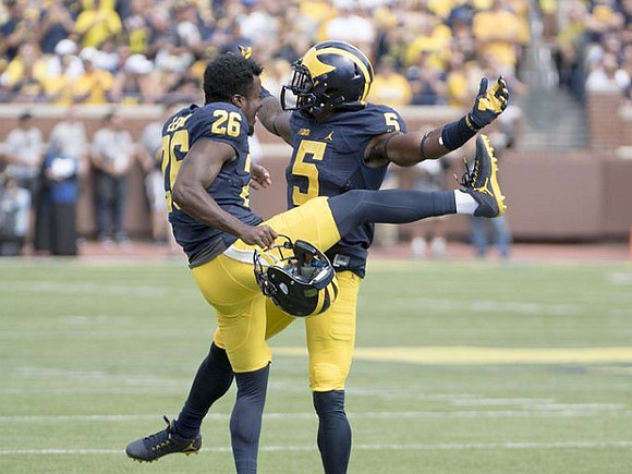 Jourdan Lewis (26) and Jabrill Peppers (5)