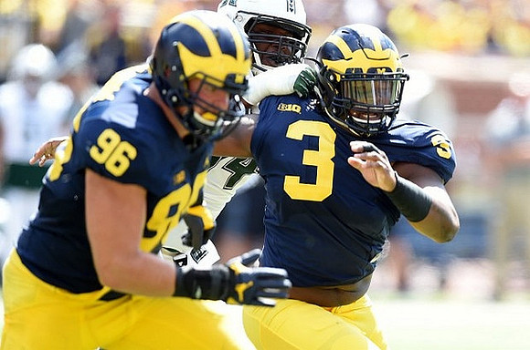 Ryan Glasgow (96) and Rashan Gary (3)