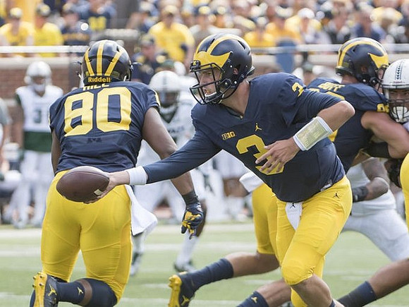 Khalid Hill (80), Wilton Speight (3), and Jake Butt (88)