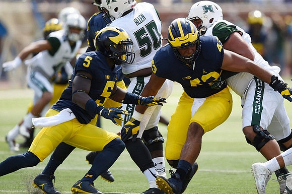 Jabrill Peppers (5) and Chris Wormley (43)