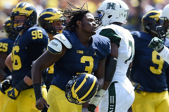Ryan Glasgow (96), Rashan Gary (3), and Mike McCray (9)
