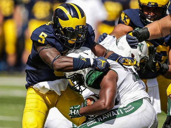 Jabrill Peppers (5) and Chris Wormley (43)