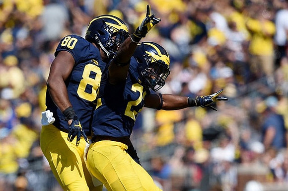 Khalid Hill (80) and Karan Higdon (22)