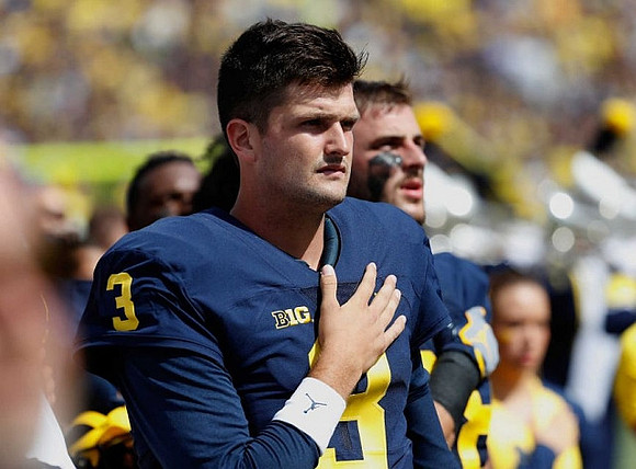 Wilton Speight (3) and Jake Butt (88)