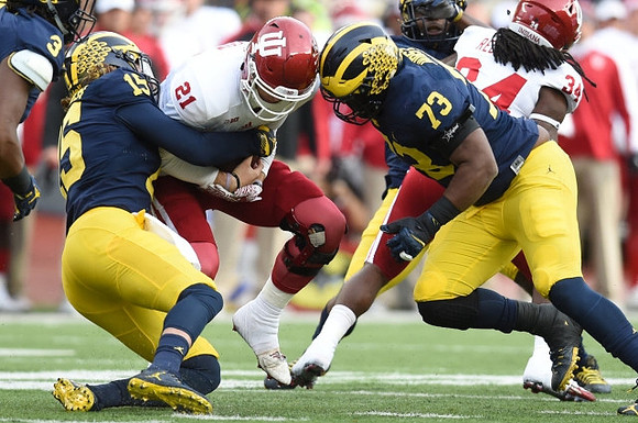 Chase Winovich (15) and Maurice Hurst (73)