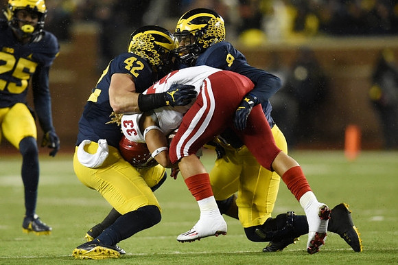 Dymonte Thomas (25), Ben Gedeon (42), and Mike McCray (9)