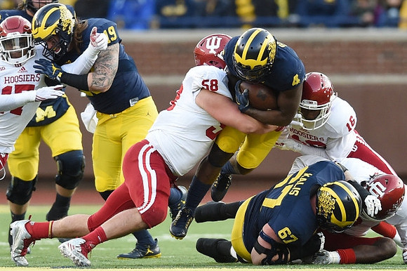 Henry Poggi (19), De'Veon Smith (4), and Kyle Kalis (67)