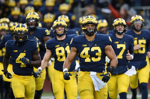 De'Veon Smith (4), Michael Jocz (81), Chris Wormley (43), Shane Morris (7), and Michigan Team