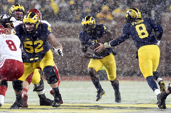 Mason Cole (52), De'Veon Smith (4), and John O'Korn (8)