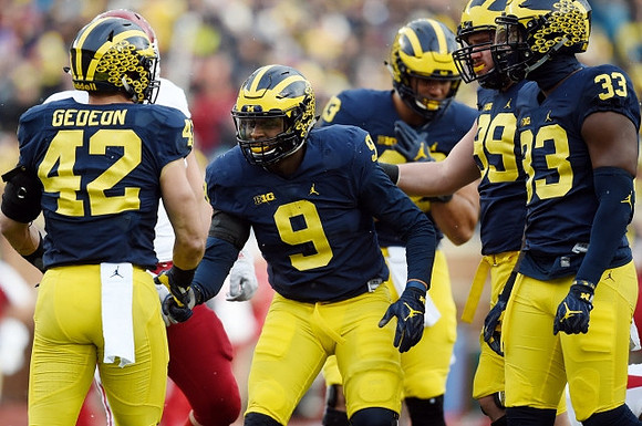 Ben Gedeon (42), Mike McCray (9), Tyree Kinnel (23), Matthew Godin (99), and Taco Charlton (33)