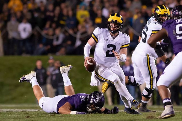 Shea Patterson (2) and Jon Runyan Jr. (75)