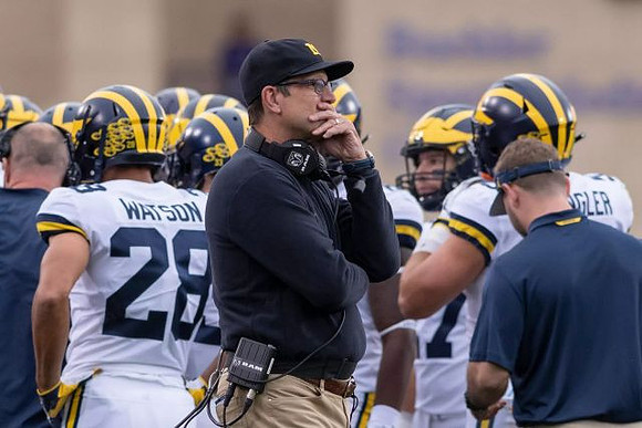 Brandon Watson (28), Jim Harbaugh, and Jared Wangler (5)