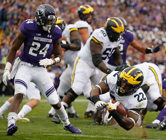 Michael Onwenu (50) and Karan Higdon (22)