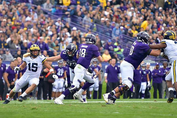 Chase Winovich (15) and Rashan Gary (3)