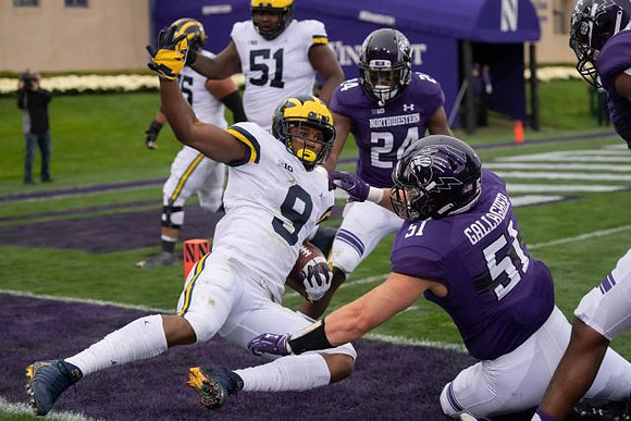 Donovan Peoples-Jones (9) and Cesar Ruiz (51)