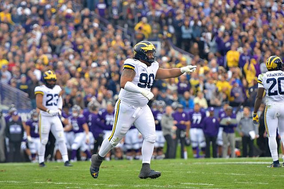 Tyree Kinnel (23), Bryan Mone (90), and Brad Hawkins (20)