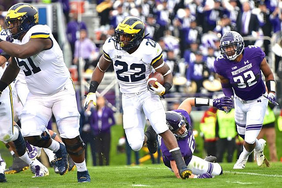 Cesar Ruiz (51) and Karan Higdon (22)