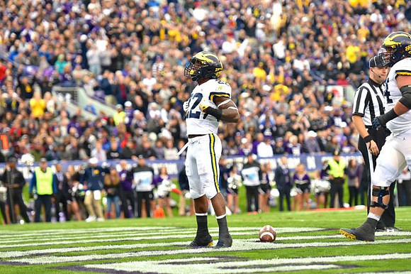 Karan Higdon (22) and Ben Bredeson (74)