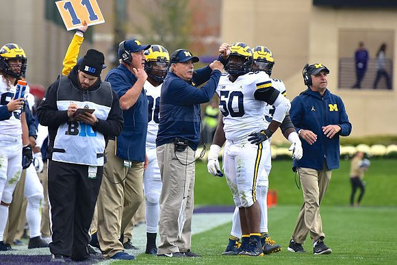 Don Brown, Michael Dwumfour (50), and Michael Zordich