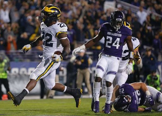 Karan Higdon (22) and Ben Mason (42)