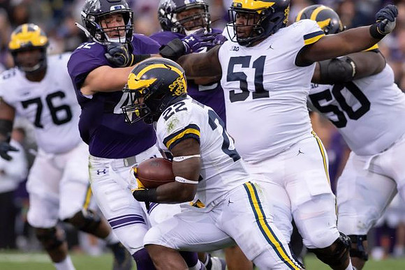 Juwann Bushell-Beatty (76), Karan Higdon (22), Cesar Ruiz (51), and Michael Onwenu (50)