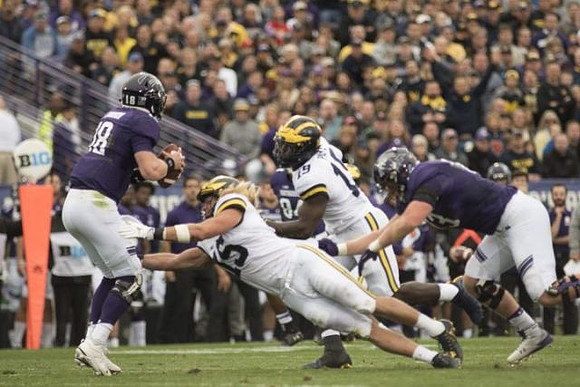 Chase Winovich (15) and Kwity Paye (19)