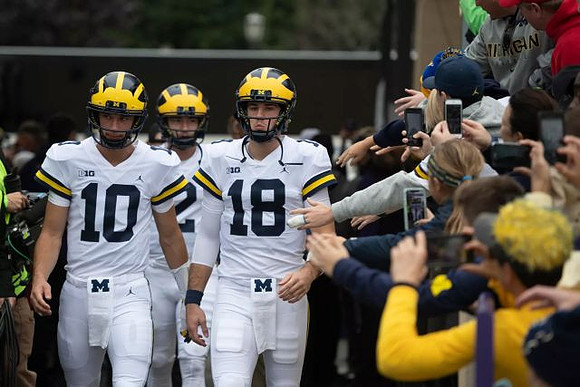 Dylan McCaffrey (10), Shea Patterson (2), and Brandon Peters (18)
