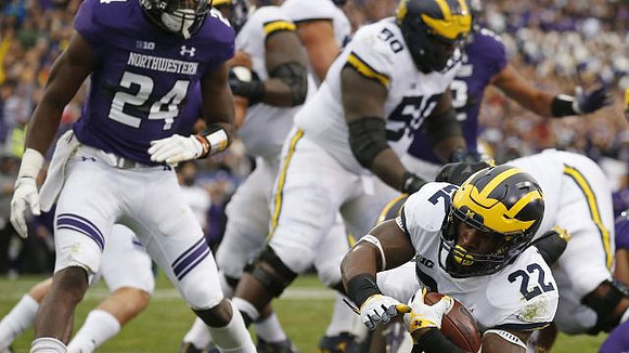 Michael Onwenu (50) and Karan Higdon (22)