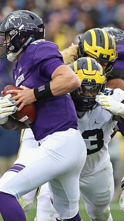 Rashan Gary (3) and Chase Winovich (15)