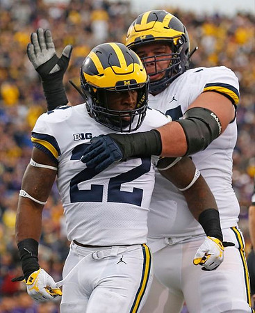 Karan Higdon (22) and Ben Bredeson (74)