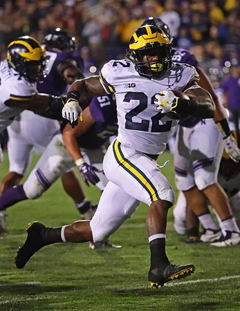 Juwann Bushell-Beatty (76) and Karan Higdon (22)