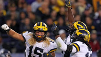 Chase Winovich (15), Michael Dwumfour (50), and Devin Bush (10)