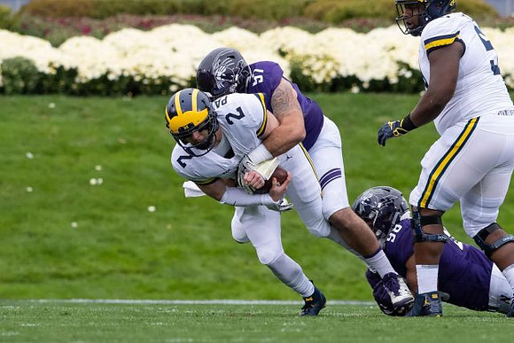 Shea Patterson (2) and Cesar Ruiz (51)