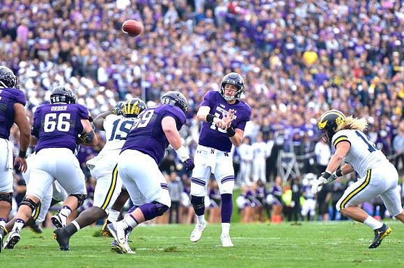 Kwity Paye (19) and Chase Winovich (15)