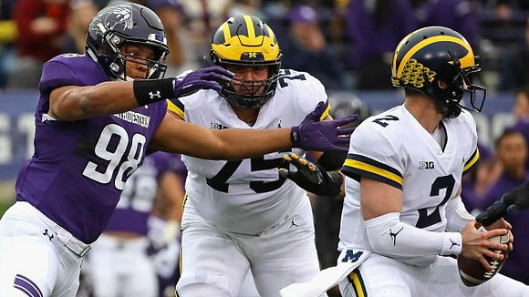 Jon Runyan Jr. (75) and Shea Patterson (2)