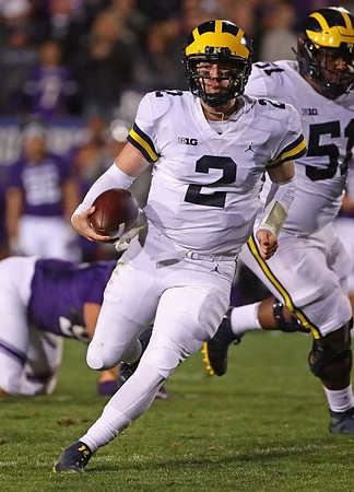Shea Patterson (2) and Cesar Ruiz (51)
